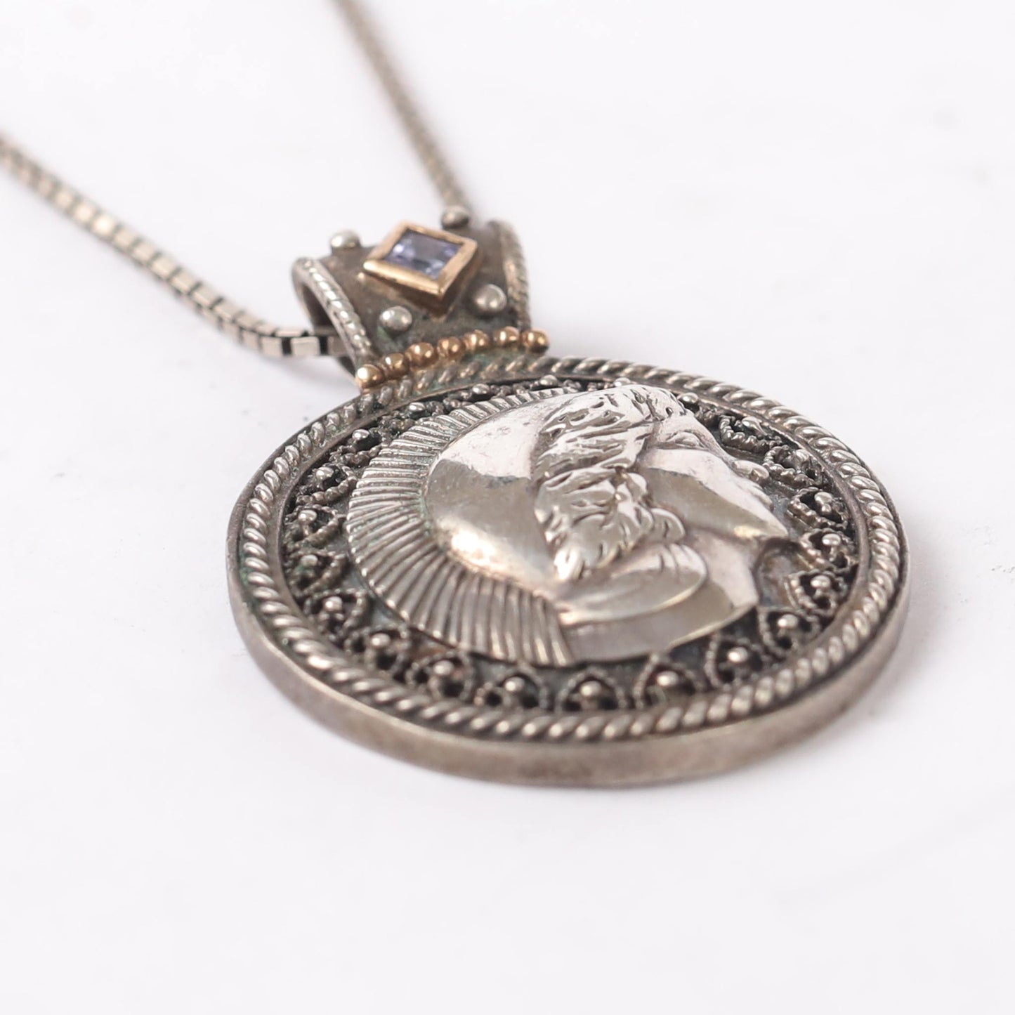 silver and touch of gold Roman coins pendant with amethyst stone