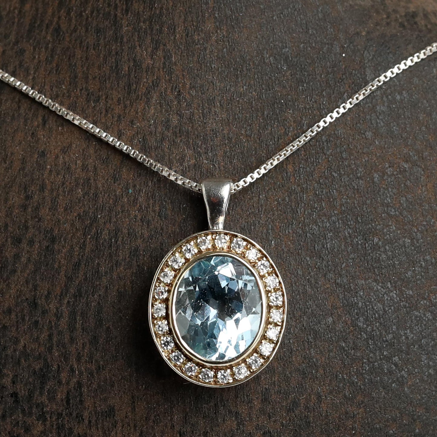 handmade silver with gold pendant with natural blue topaz stone